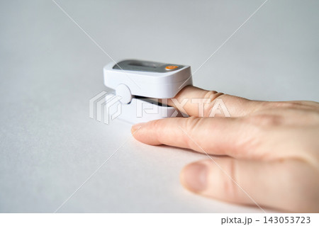 Finger Placed Inside Pulse Oximeter Device Showing Oxygen Level Measurement And Health Monitoring Finger Placed Inside Pulse Oximeter Device Showing Oxygen Level Measurement And Health Monitoring 143053723