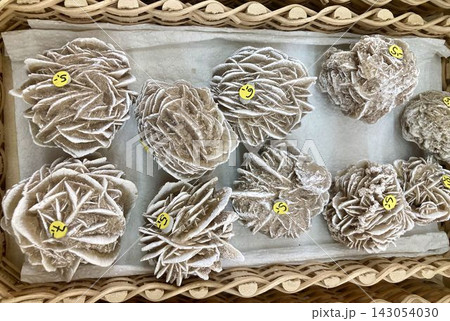 Desert rose gypsum crystal specimens in a basket in Mittenwald, Bavaria, Germany 143054030