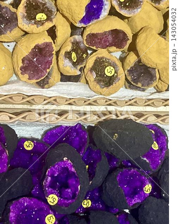Vibrant dyed purple quartz geode slices in Mittenwald, Bavaria, Germany  143054032