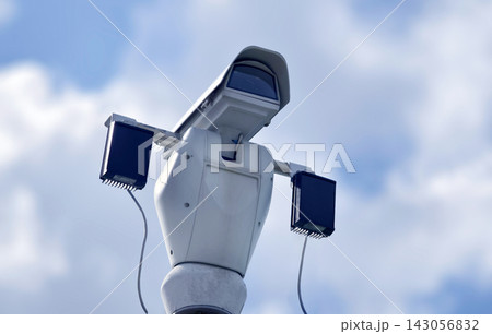 Cluster of outdoor security cameras mounted on metal pole watching property Cluster of outdoor security cameras mounted on metal pole watching property 143056832