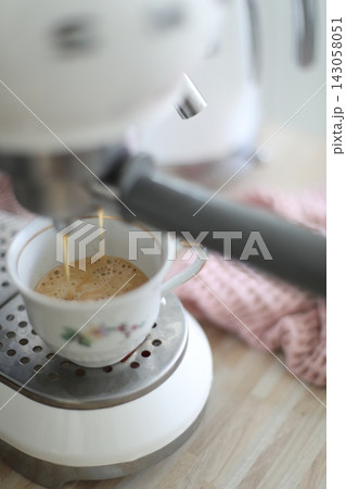 coffee machine making coffee at home. cozy morning. hot coffee latte and cappuccino in a glass and mug coffee machine making coffee at home. cozy morning. hot coffee latte and cappuccino in a glass and mug 143058051