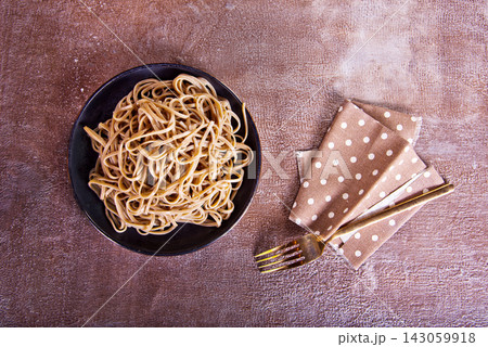 Pasta, buckwheat noodles cooking on plate 143059918