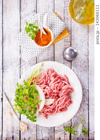 Raw beef and pork mince meat, mincemeat, on light background. Raw beef and pork mince meat, mincemeat, on light background. 143060111