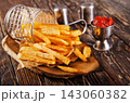 Crisp golden brown curly fried potato 143060382