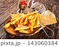 Crisp golden brown curly fried potato  143060384