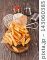 Crisp golden brown curly fried potato  143060385