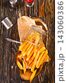 Crisp golden brown curly fried potato  143060386