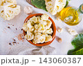 Head of cauliflower sits on a light table 143060387