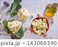 Head of cauliflower sits on a light table 143060390