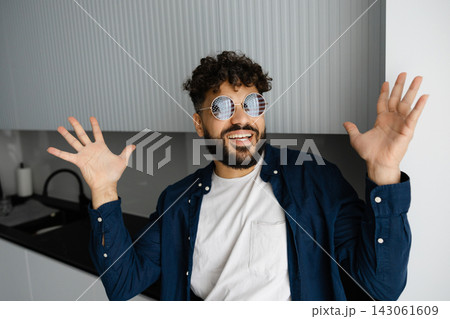 Happy man in patriotic sunglasses making a gesture Happy man in patriotic sunglasses making a gesture 143061609