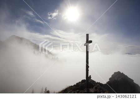 Summit cross at Taubenstein mountain, Mangfall Mountains, Bavaria, Germany Summit cross at Taubenstein mountain, Mangfall Mountains, Bavaria, Germany 143062121