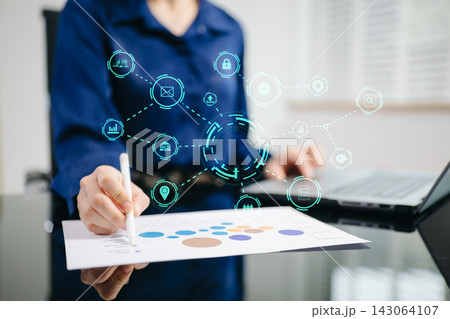 Digital marketing media in virtual screen.businesswoman hand working with mobile phone and modern compute with VR icon diagram at office 143064107