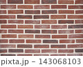 Traditional red brick wall showing repeating horizontal lines and texture 143068103