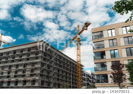 Urban Construction Site with Tower Crane and Scaffolding Urban Construction Site with Tower Crane and Scaffolding 143070031