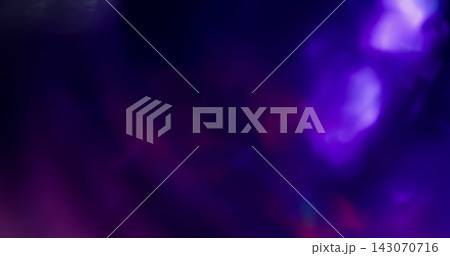 Defocused glow. Color light flare. Blur blue purple pink optical texture illuminated glint on art neon kaleidoscope bokeh dark black background. Defocused glow. Color light flare. Blur blue purple pink optical texture illuminated glint on art neon kaleidoscope bokeh dark black background. 143070716