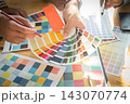 Interior designer chooses a color chart for home design. Graphic designers working on color chart at modern office. 143070774
