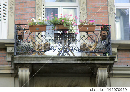 Cozy balcony with sun loungers and flower vases 143070959