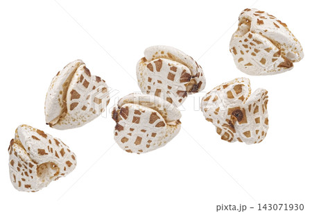 Falling puffed buckwheat grains isolated on white background with clipping path, full depth of field Falling puffed buckwheat grains isolated on white background with clipping path, full depth of field 143071930