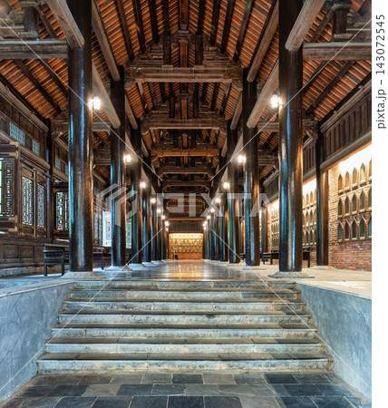 The Arhat Corridor at Bai Dinh Pagoda with traditional wooden columns and golden statues in Ninh Binh, Vietnam 143072545