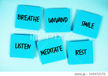 Relaxation concept : Breathe, Unwind, Smile, Listen, Meditate, Rest message written on paper notes 143072570