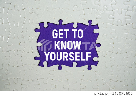 Jigsaw puzzle with a missing piece with "Get To Know Yourself" on purple background 143072600