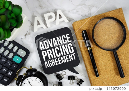 APA - Advance Pricing Agreement acronym with calculator, alarm clock and magnifying glass, Business concept background 143072990