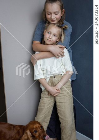 Carefree blond sister and brother indoor portrait. Happy children Carefree blond sister and brother indoor portrait. Happy children 143073214