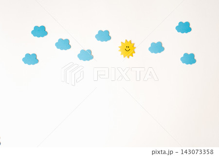 Border of application of blue clouds and the sun on a white background. The concept of variable weather clouds or mood. Copy space Border of application of blue clouds and the sun on a white background. The concept of variable weather clouds or mood. Copy space 143073358