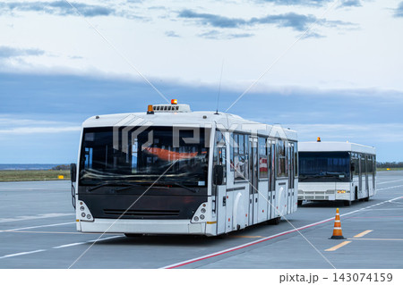 Two airport shuttle bus in the evening Two airport shuttle bus in the evening 143074159