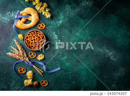 Oktoberfest background with brezel, hops and malt 143074207