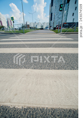 Pedestrian Crosswalk View directly on City Street 143074509