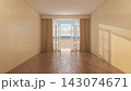 Empty Interior with Open French Doors Overlooking Sunny Beach 143074671