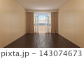 Empty Coastal Interior with Open French Doors Overlooking the Beach 143074673