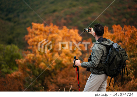 Capturing the beauty of autumn while hiking in the colorful hills 143074724