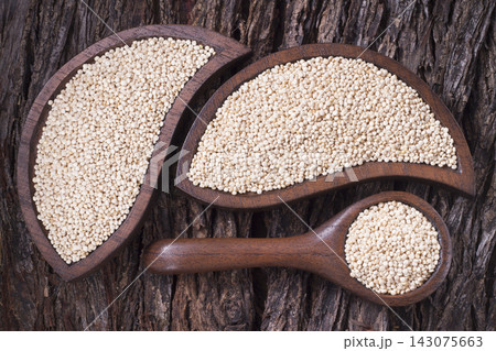 Quinoa seeds in bowl on rustic wood Quinoa seeds in bowl on rustic wood 143075663