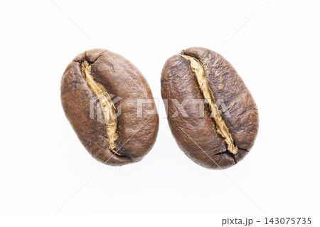 Two Roasted Coffee Beans Closeup Isolated White Two Roasted Coffee Beans Closeup Isolated White 143075735