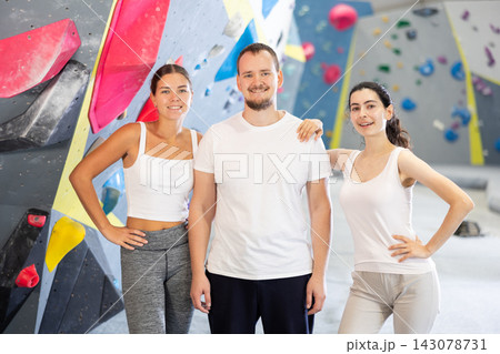 Portrait of three athletic people in climbing gym 143078731