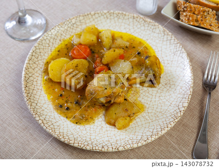 Homemade fried chicken legs with garnish of boiled potatoes 143078732