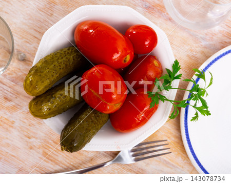 Appetizing pickled cucumbers and tomatoes 143078734