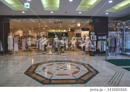 April 30 2026 A Fashion boutique storefront with mannequins 143080888