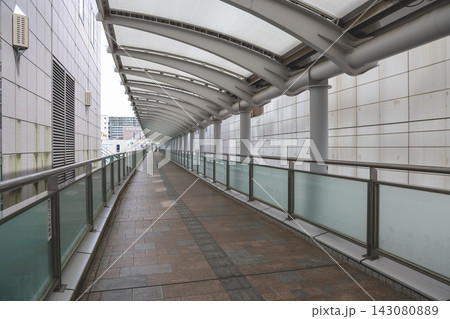 April 30 2026 Covered pedestrian walkway with curved canopy and modern architecture April 30 2026 Covered pedestrian walkway with curved canopy and modern architecture 143080889