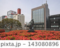 April 30 2026 Koriyama city sculpture with flowers and modern buildings 143080896