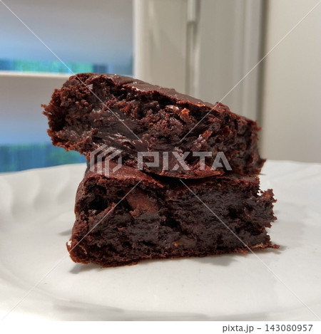 Rich, gooey fudge brownies with a dense, chocolatey center and a perfectly crisp top. Ideal for chocolate lovers craving a satisfying, indulgent treat. Rich, gooey fudge brownies with a dense, chocolatey center and a perfectly crisp top. Ideal for chocolate lovers craving a satisfying, indulgent treat. 143080957