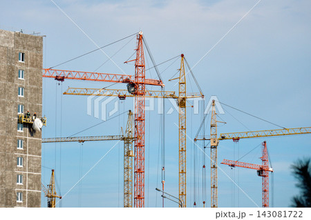 Sustainable urban development construction site with tower cranes and green building standards Sustainable urban development construction site with tower cranes and green building standards 143081722