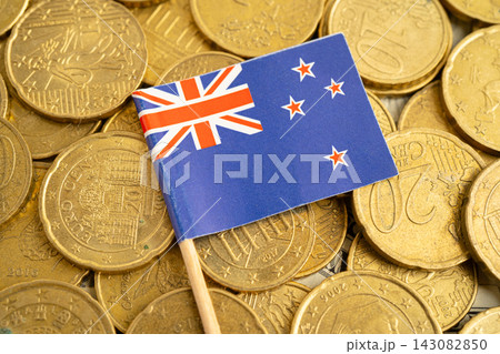 New Zealand flag on coins background for finance banking business. New Zealand flag on coins background for finance banking business. 143082850