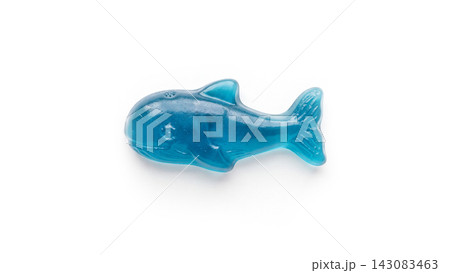 Blue gummy candy in the shape of a whale isolated on a plain white background with confectionery delicious appetizing flavored isolated background textured translucent colorful miniature Blue gummy candy in the shape of a whale isolated on a plain white background with confectionery delicious appetizing flavored isolated background textured translucent colorful miniature 143083463