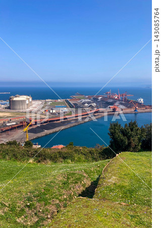 Gijon port settlements amidst scenic coastal landscapes in Gijon, Asturias, Spain Gijon port settlements amidst scenic coastal landscapes in Gijon, Asturias, Spain 143085764