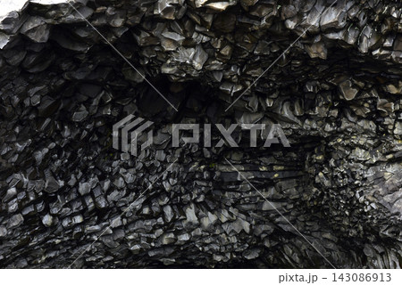 Intricate texture of volcanic basalt columns on Reynisfjall mountain Iceland 143086913