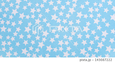 A textured background made of blue fabric with a star pattern 143087222