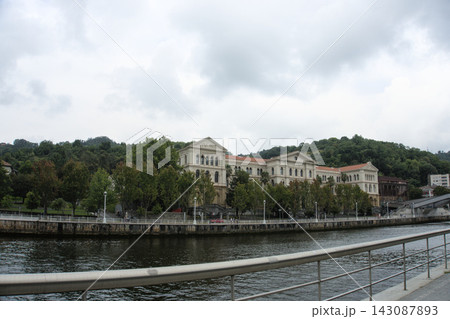 Heavy clouds over the Nervion estuary and the far bank in Bilbao, Spain 143087893